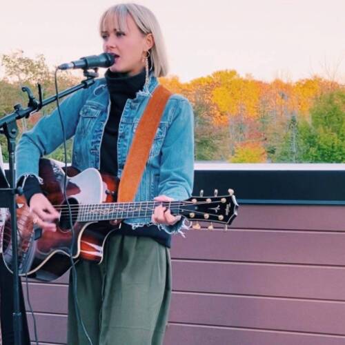 Meg Gunia singing on stage